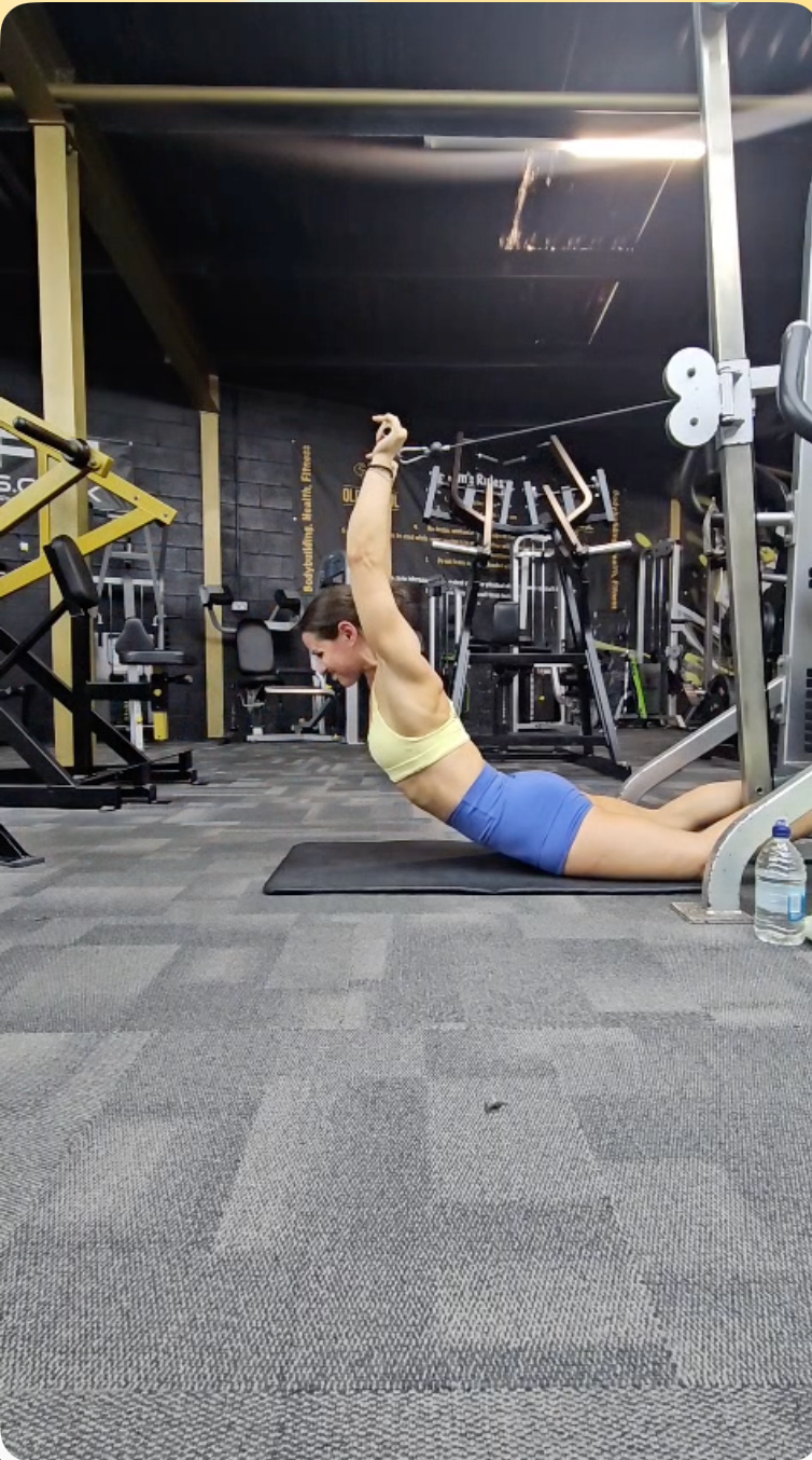 Athlete performing a floor cable movement in Coastal Blue shorts